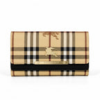 A Burberry wallet in the iconic beige, brown, and black check pattern, featuring a gold-tone metal plaque with the brand name and a gold equestrian logo on the front flap.
