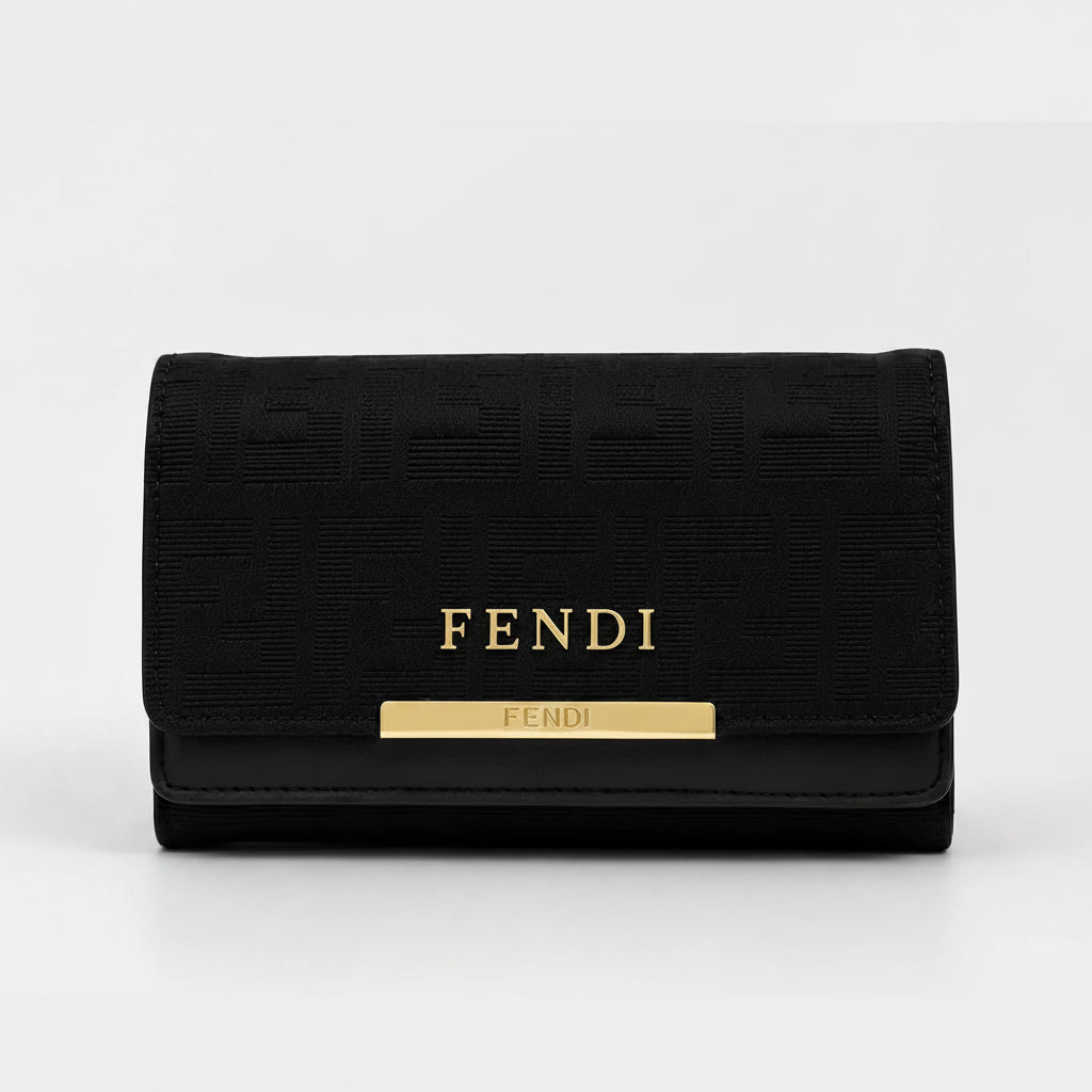 A black Fendi wallet featuring the brand name in gold lettering and a gold bar accent on the front, set against a plain light gray background.